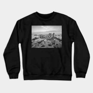 Seaweed covered rocks a the sandy beach Crewneck Sweatshirt